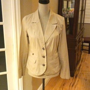 Long sleeved, tan colored, 3 button jacket